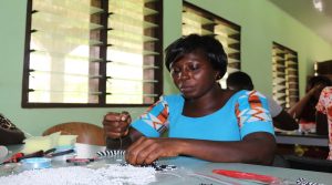 Beneficiaries practising on the beads making# 3 1JPG