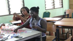 Rita Amoah having her hands on the beads making 1JPG